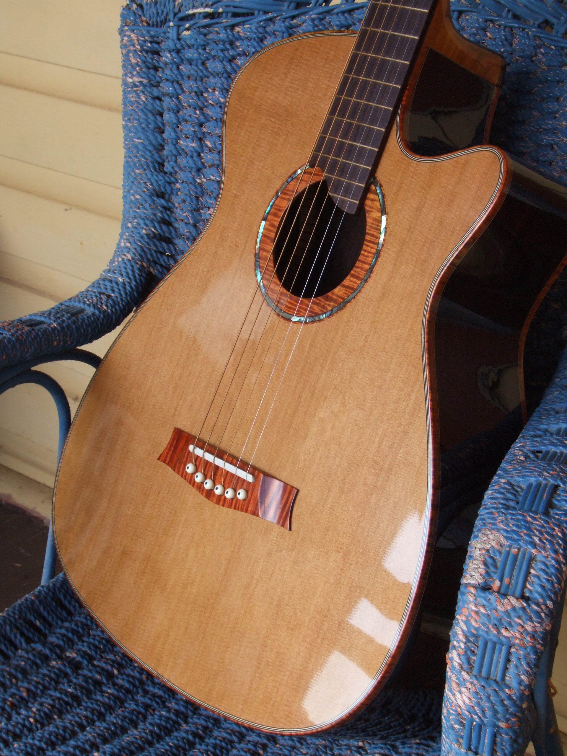 Custom guitars. Cedar and rosewood medium sized steel string guitar, Australian blackwood trim.