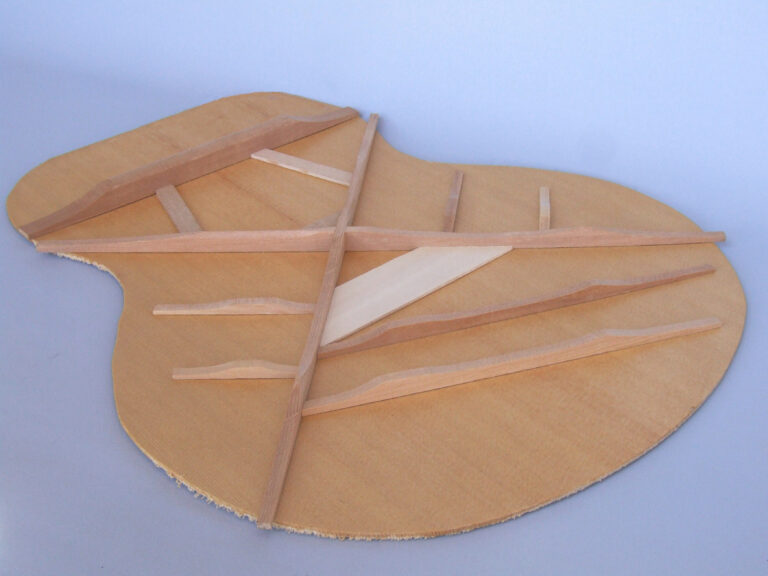 Traditional Xbracing on the underside of a guitar top panel Gore