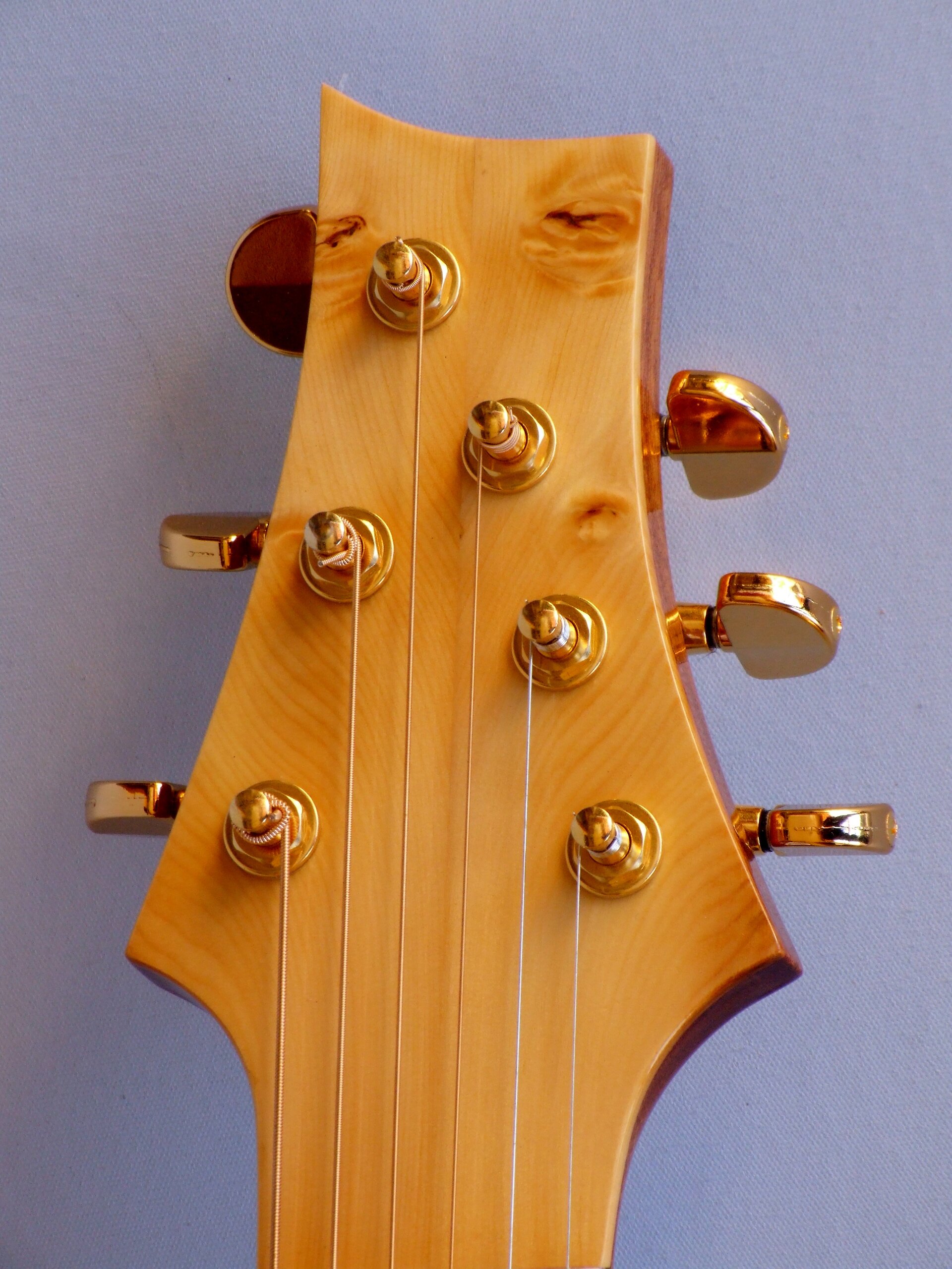 Custom guitars. Huon pine headstock facing on The Shed guitar