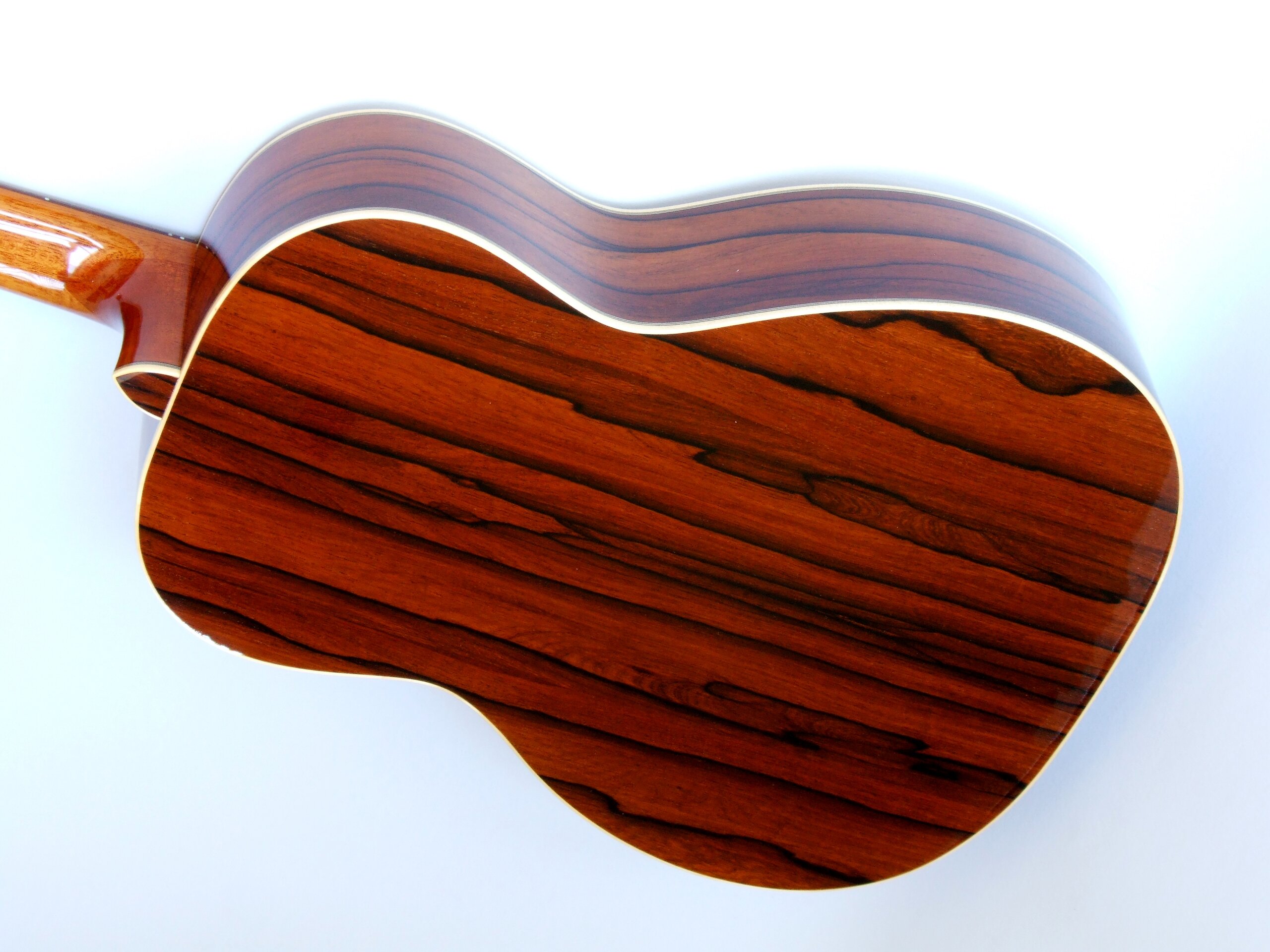 Custom guitars. Madagascar rosewood back of a 12 fret 00 guitar