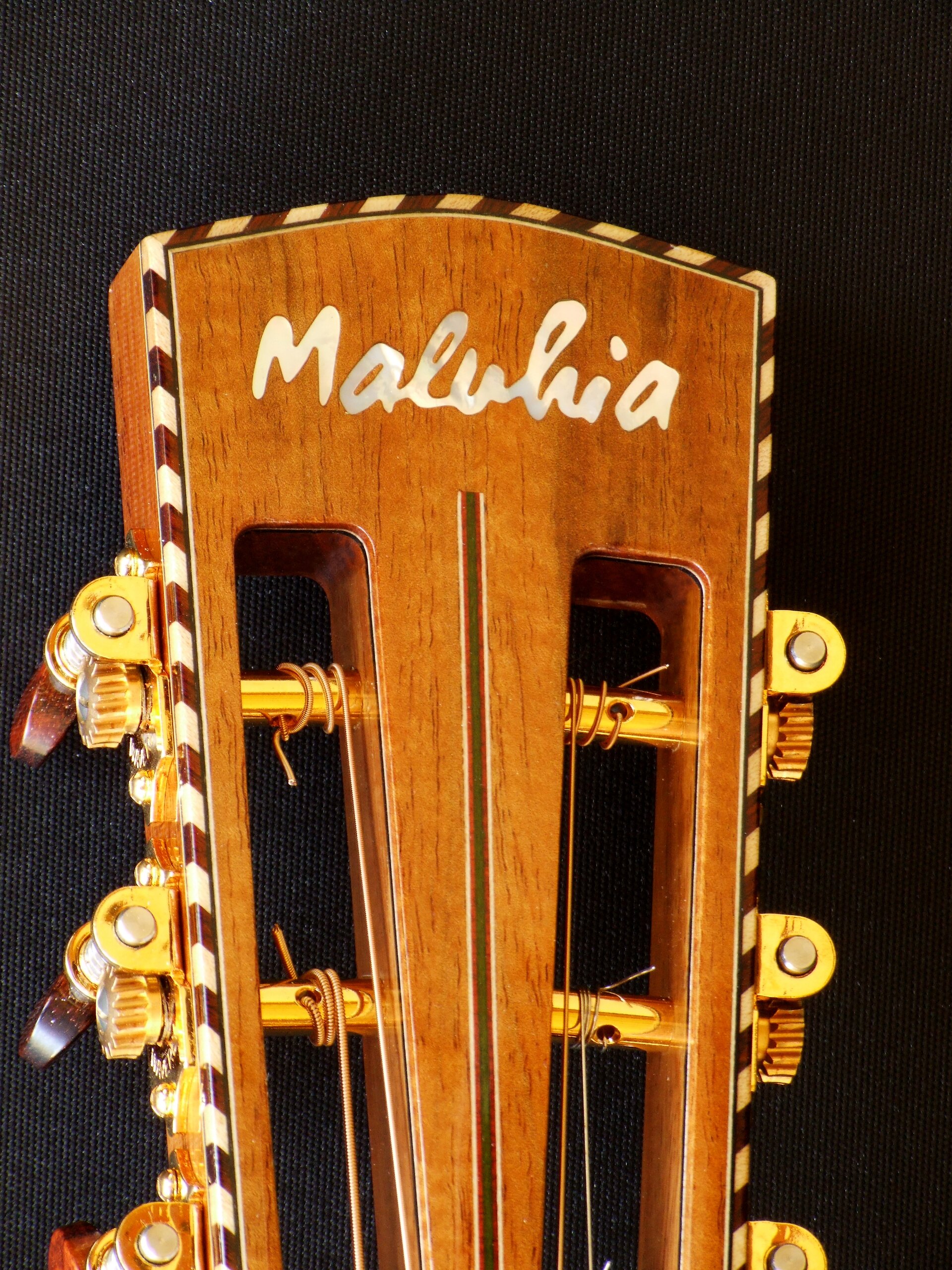 Custom guitars. Maluhia head stock inlay with rope binding
