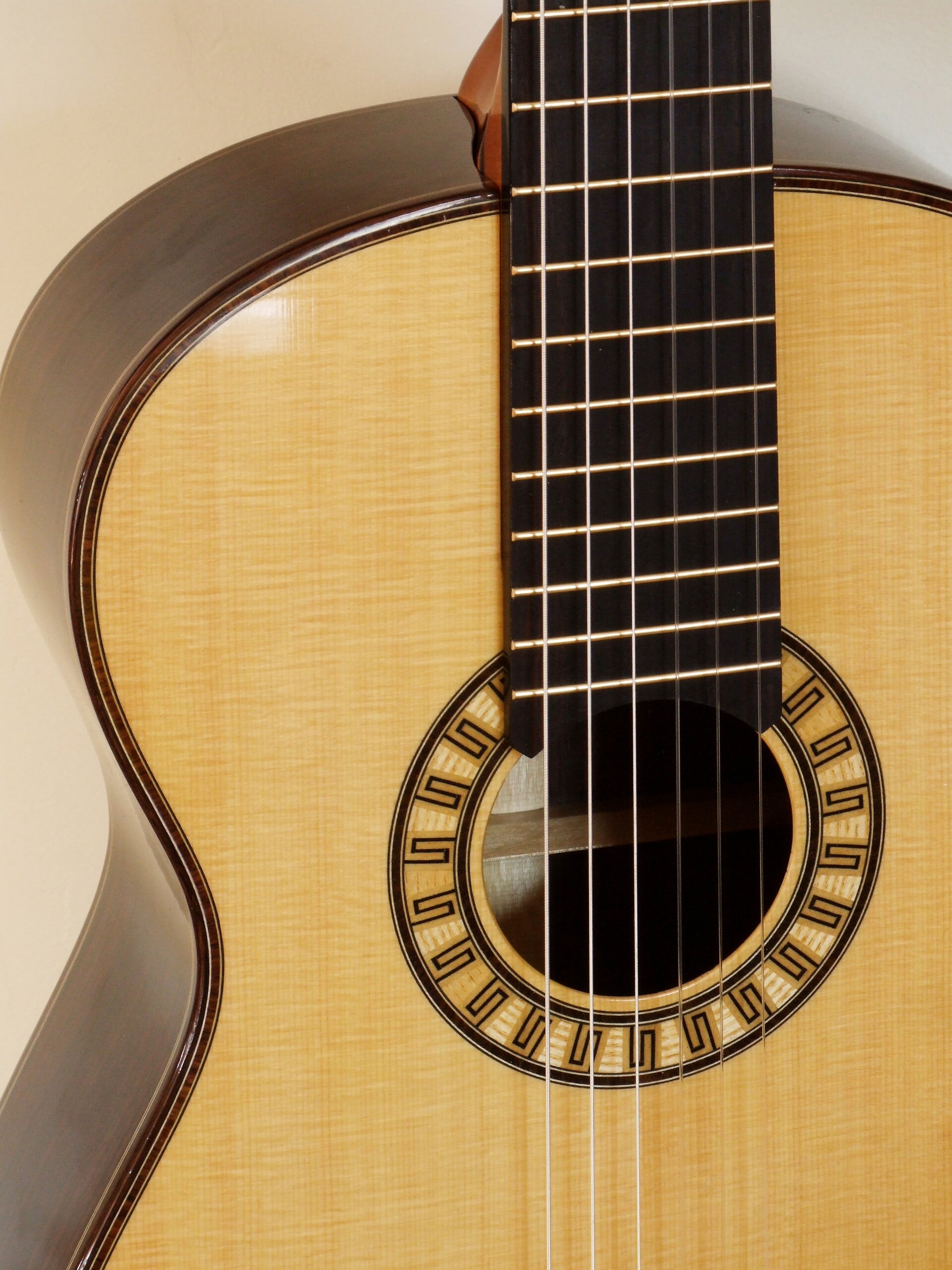 Custom guitars. Small body classical guitar with bold meander rosette