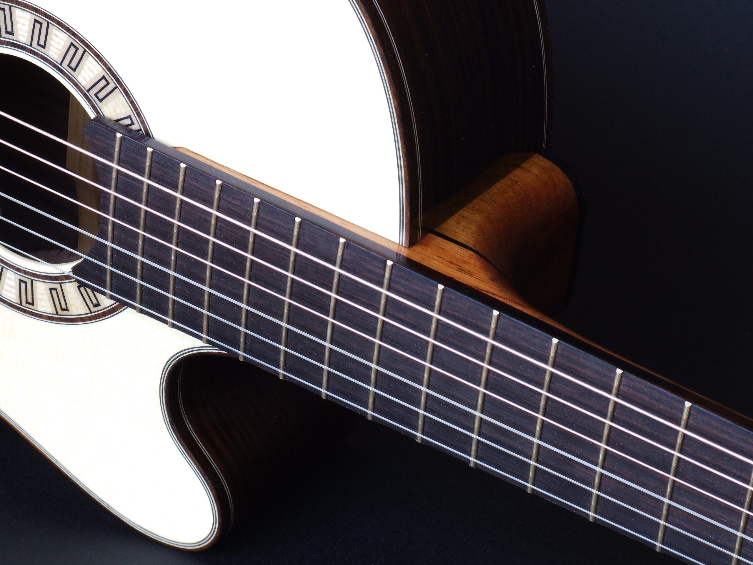 Custom guitars. Tilt neck joint on a cutaway classical guitar