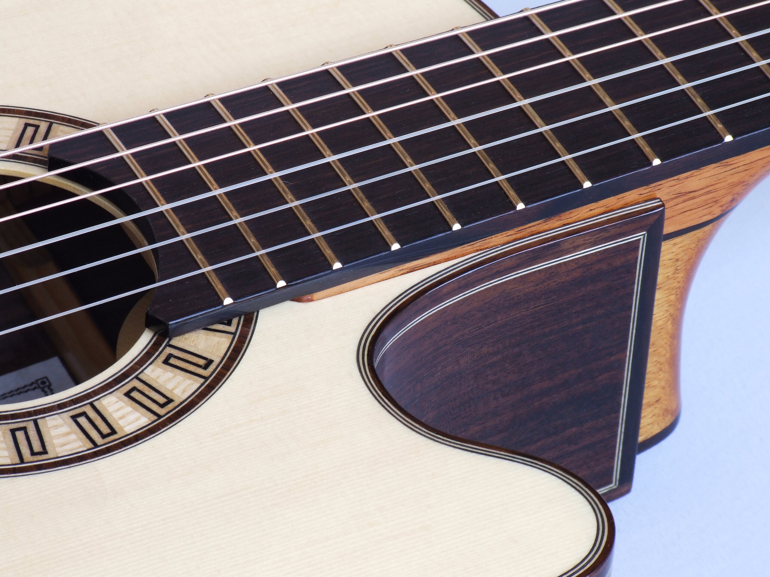 Custom guitars. Neck joint on a Gore smallbody cutaway tilt-neck classical guitar