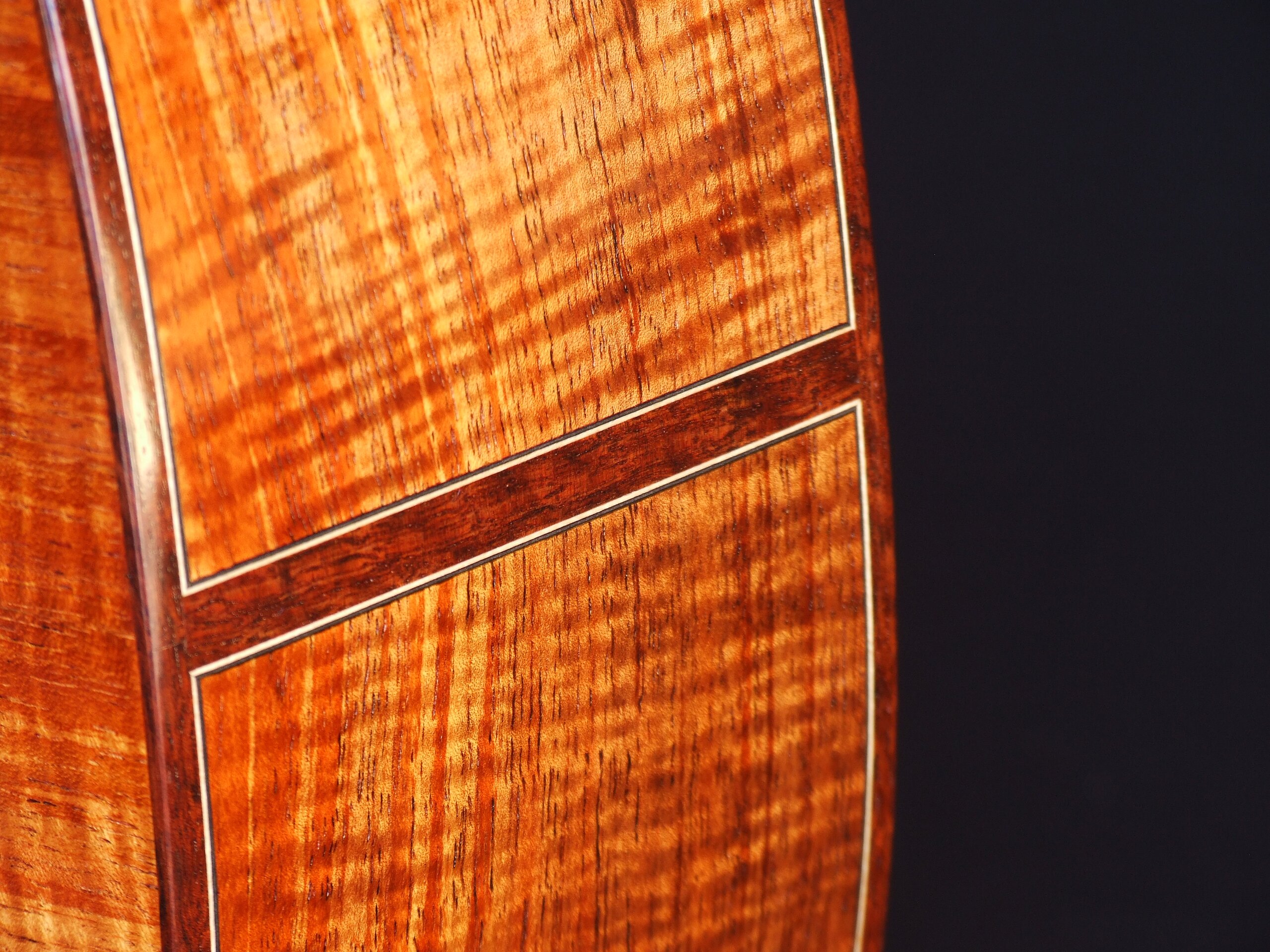 Custom guitars. Jarrah butt inlay on a guitar with figured Australian blackwood back and sides