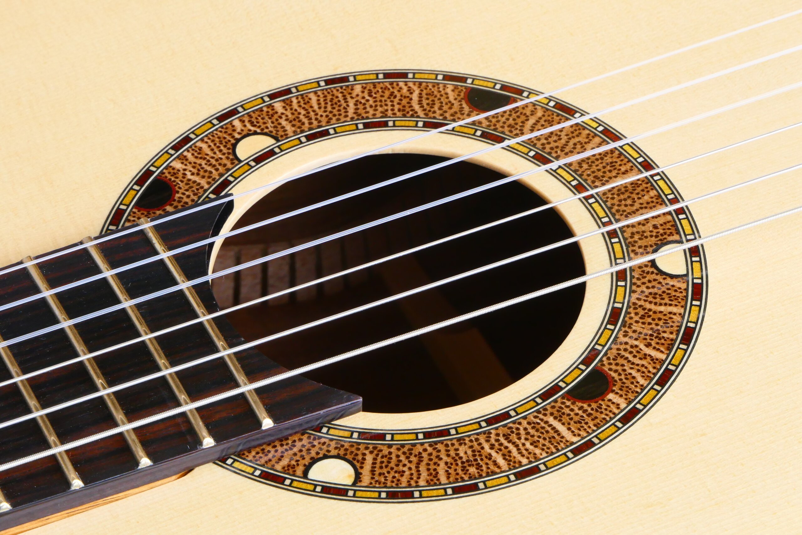 Custom guitars. Australiana rosette in a spuce topped tilt-neck classical guitar