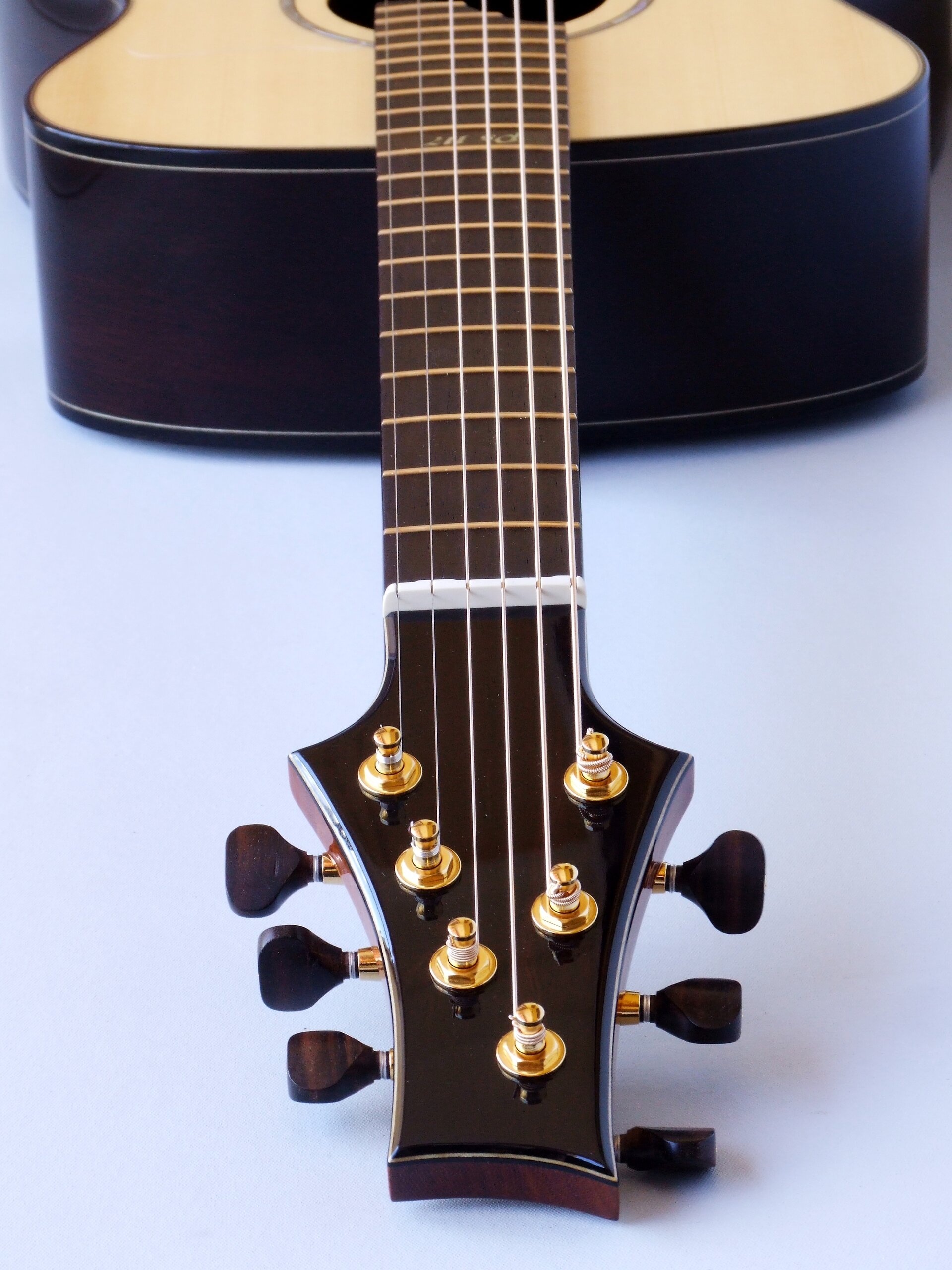 Custom guitars. View down the neck of a straight string pull guitar