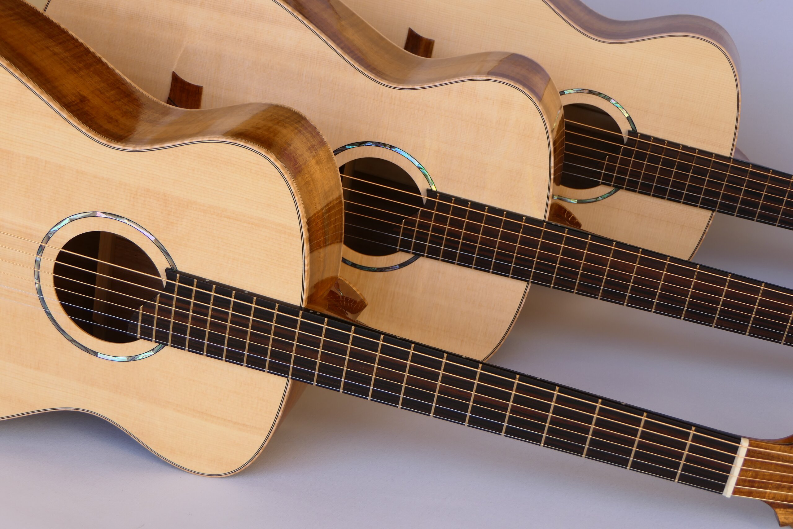 Custom guitars. Matched set of three small body steel string guitars