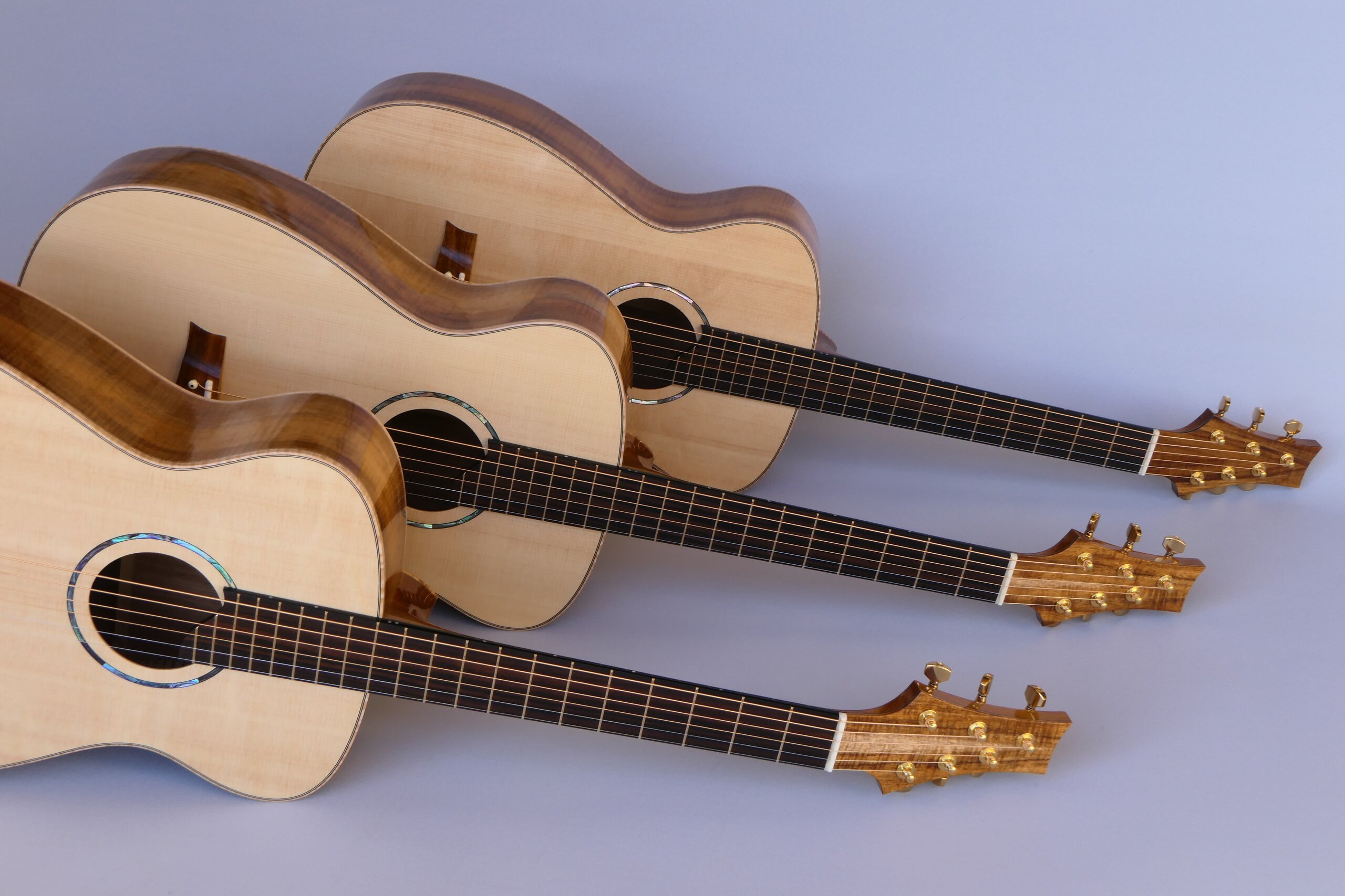 Custom guitars. Matched set of three small body steel string guitar by Trevor Gore