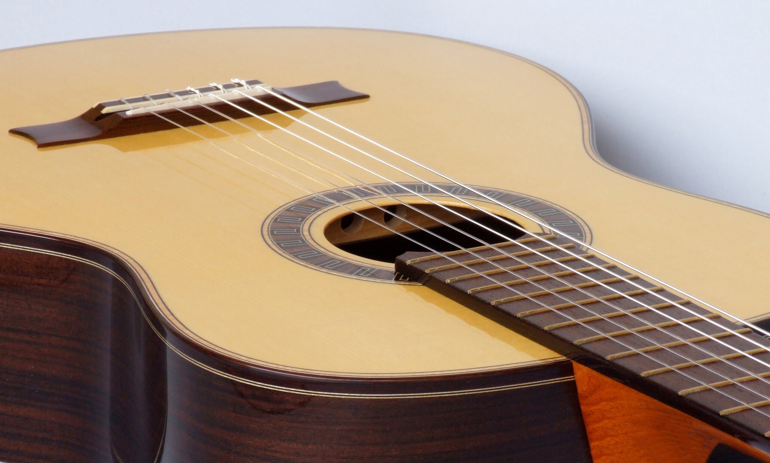 Custom guitars. Classical guitar with spruce top and meander rosette