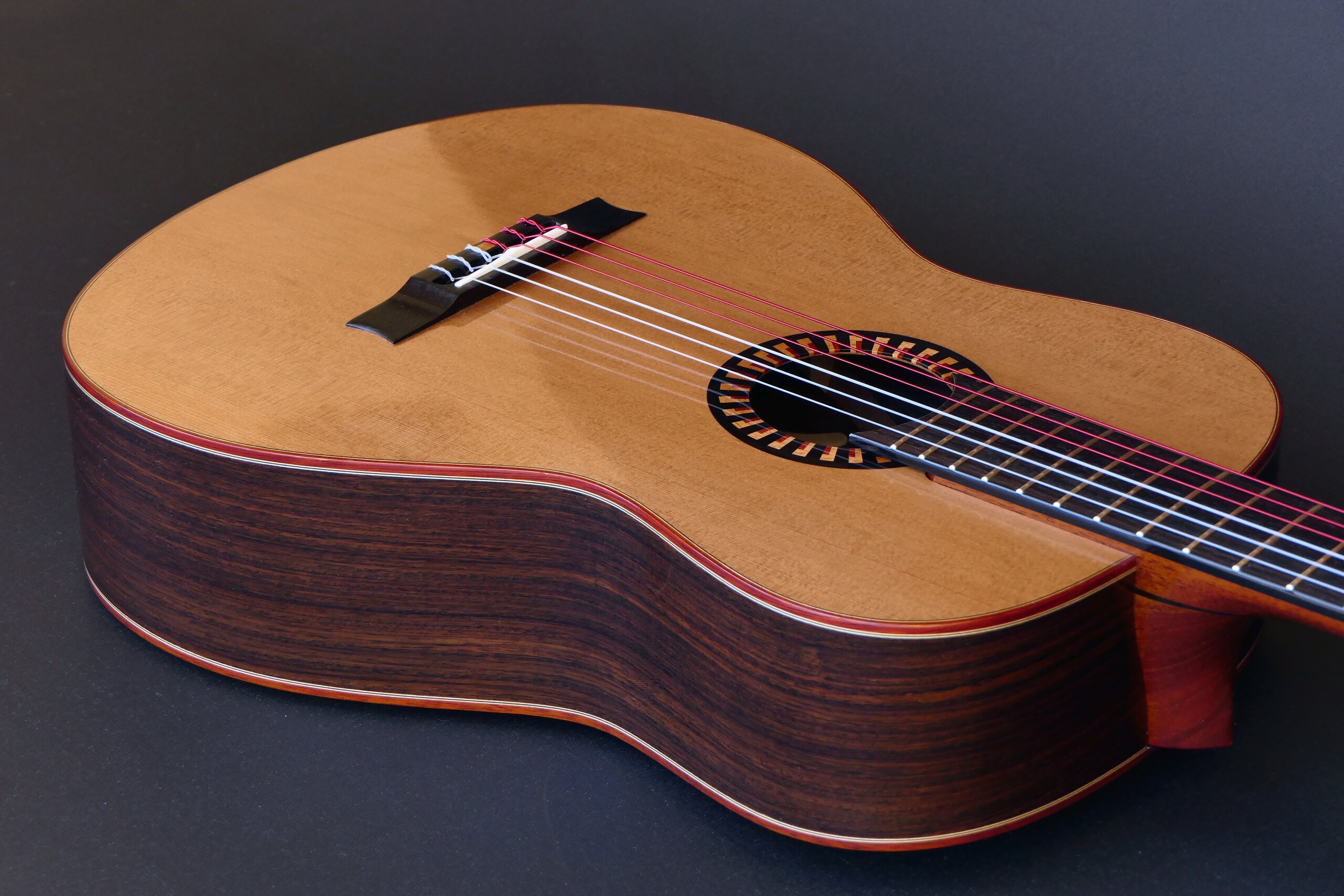 Custom guitars. Classical guitar with cedar top, rosewood sides, bloodwood binding