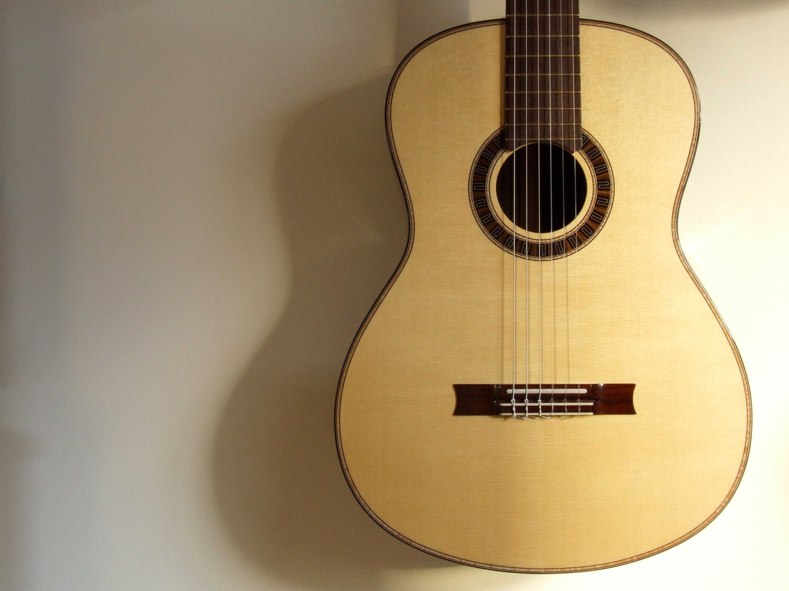 Custom guitars. Spruce topped classical guitar with meander rosette