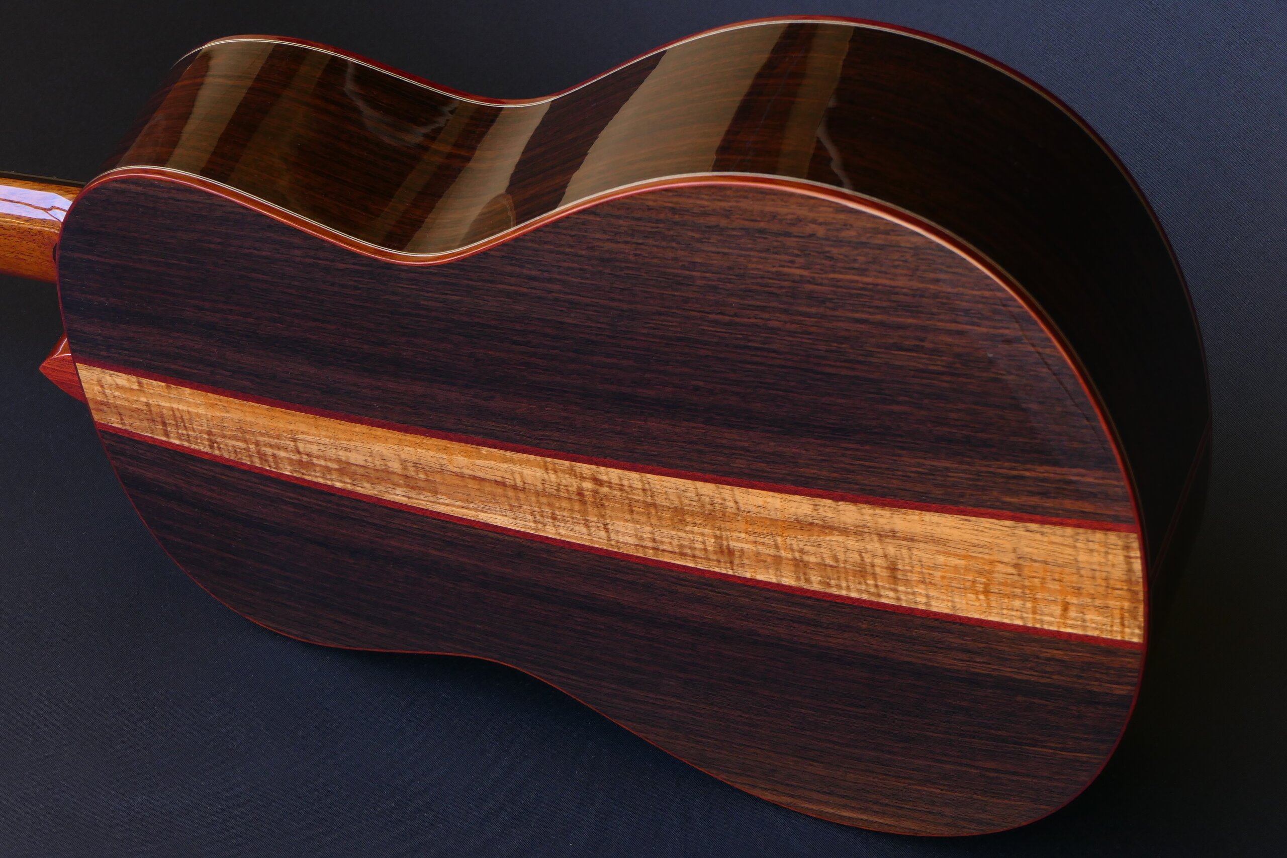 Custom guitars. Gore classical guitar with three piece back in roeswood with blackwood centre strip