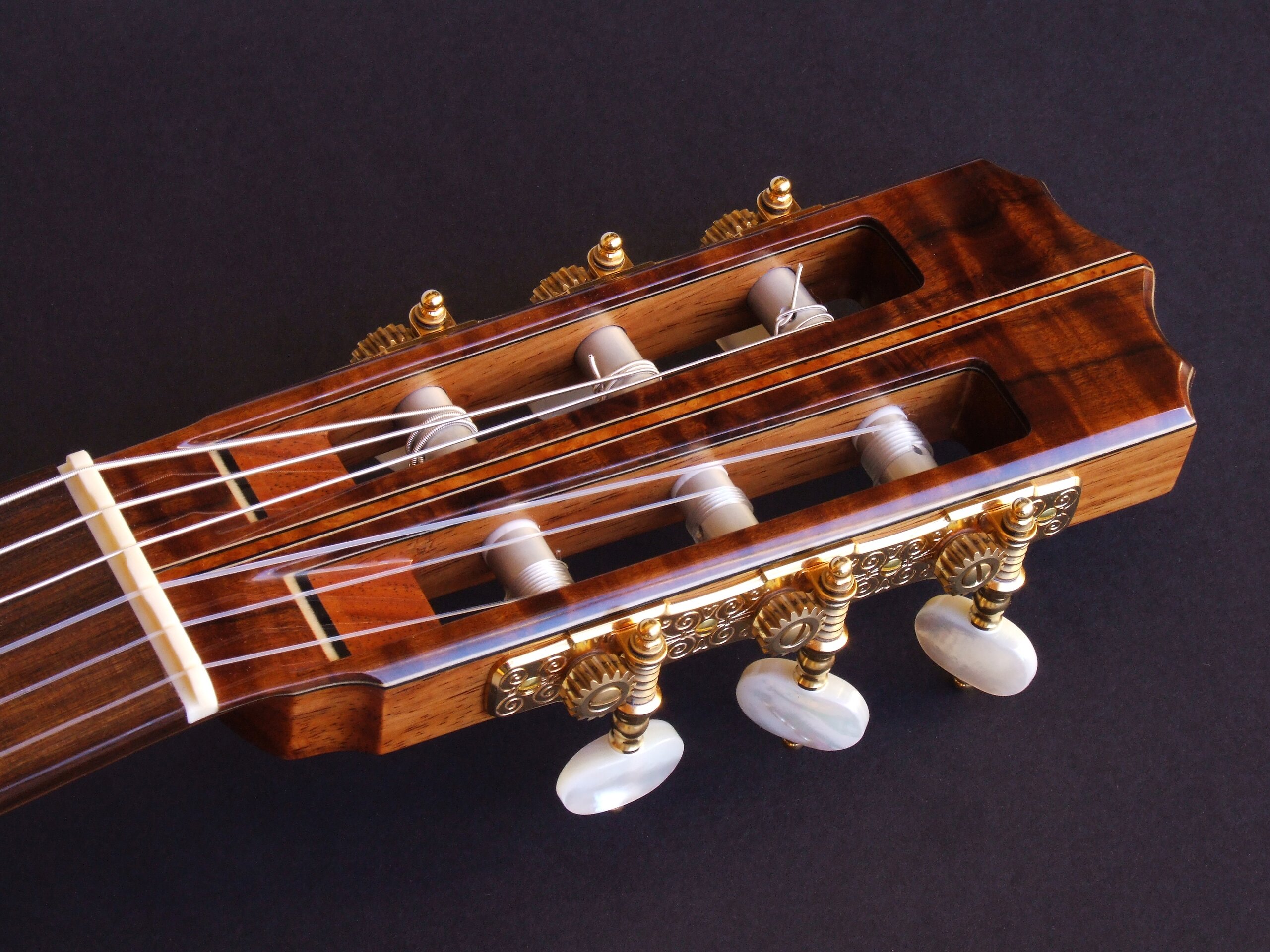 Custom guitars. Gidgee faced classical guitar headstock with Gotoh tuners and pearl buttons