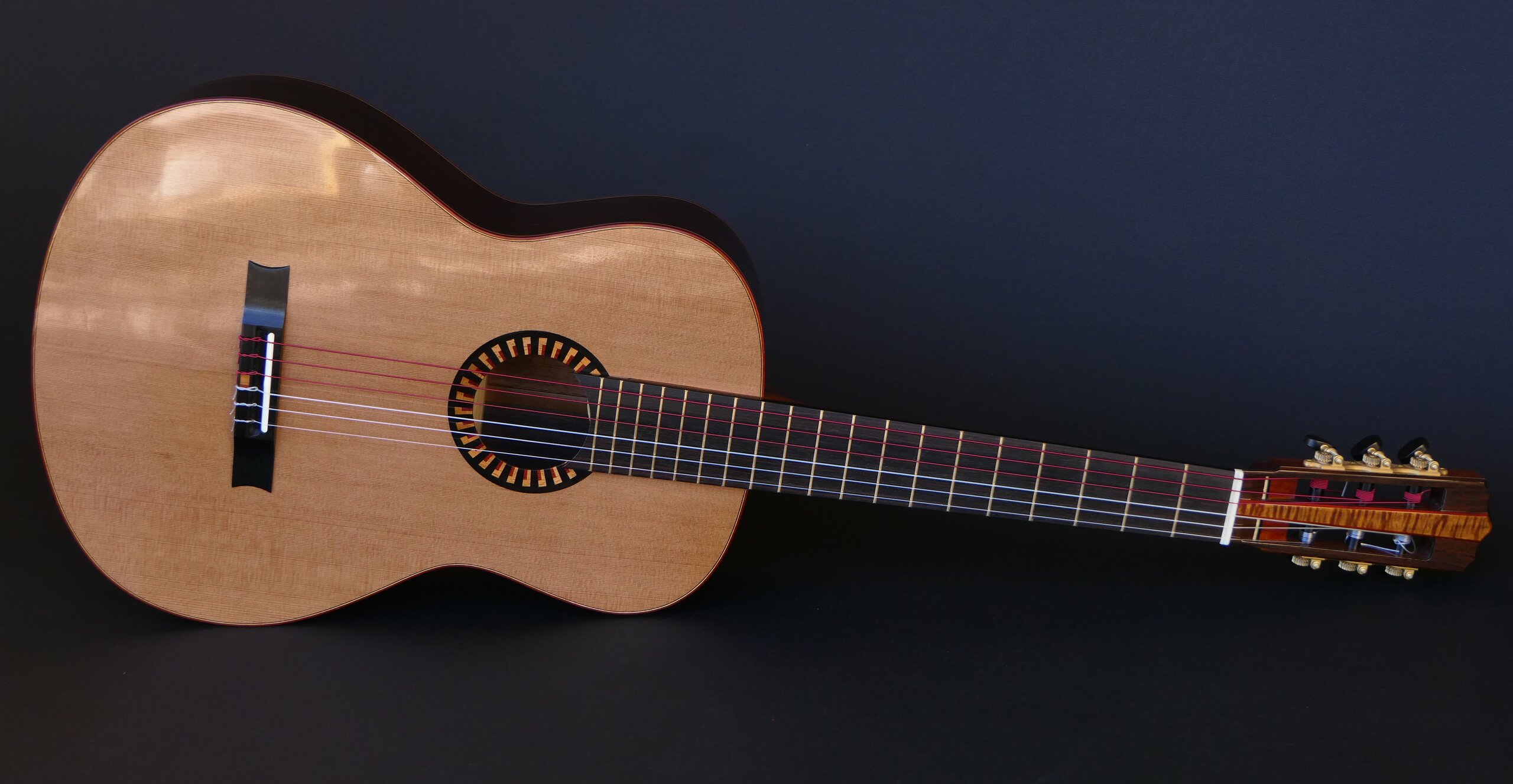 Custom guitars. Gore classical guitar with cedar top and art deco trim